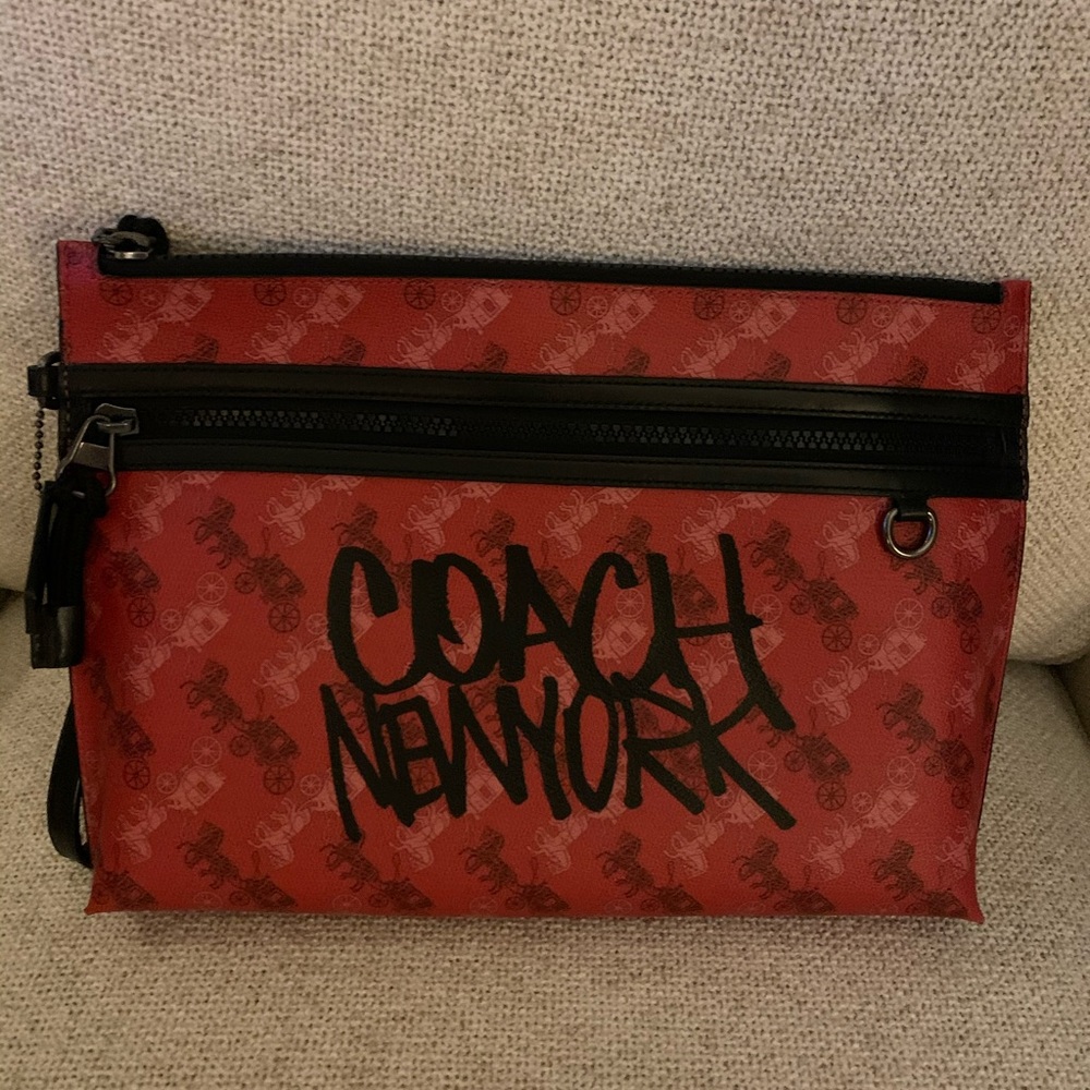 Coach envelope wristlet gender neutral.